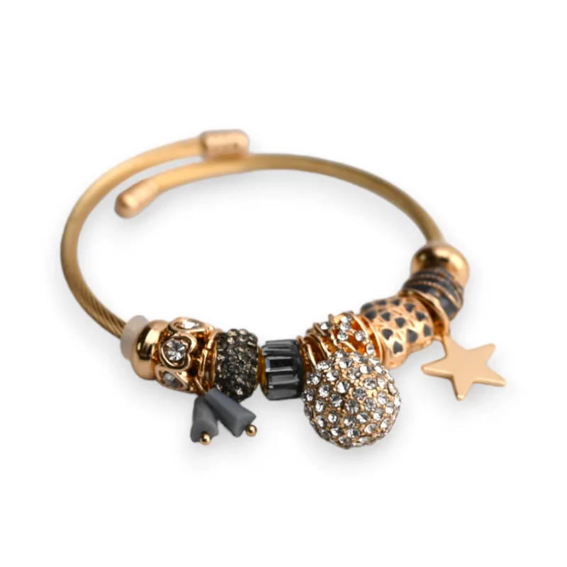 Brazalete rígido gris y dorado con charms bola de strass