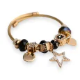 Brazalete de encantos rígido dorado y negro estrella