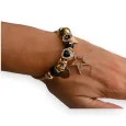 Brazalete de encantos rígido dorado y negro estrella