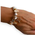 Brazalete de charms rígido dorado y blanco estrella