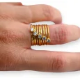 Golden steel ring with rhinestone spring