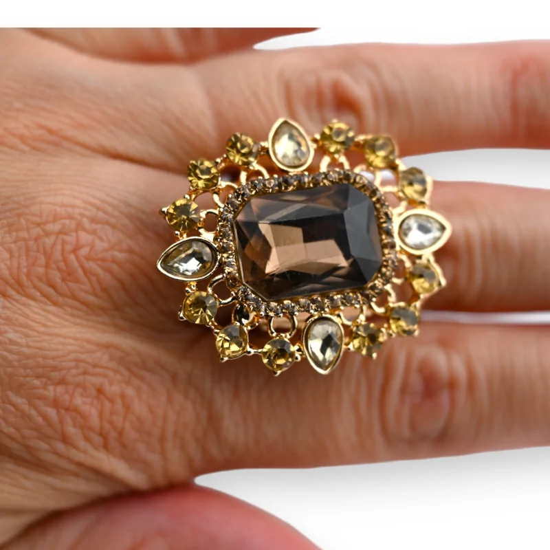 Fancy gold ring with a big brown stone