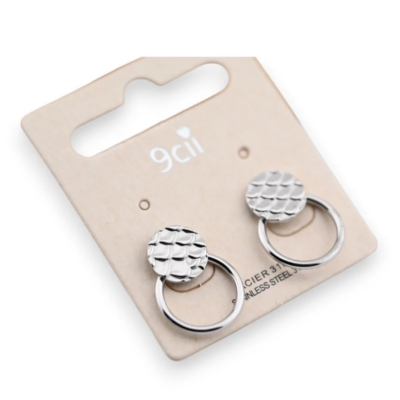 discretSilver steel earring in a discreet circle design