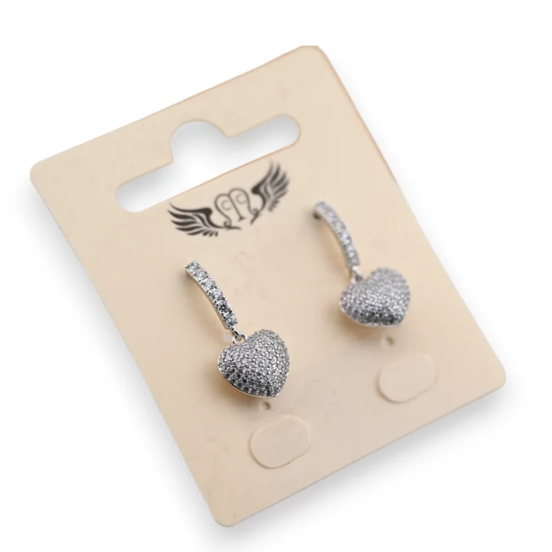 Fancy silver dangling earrings with heart relief