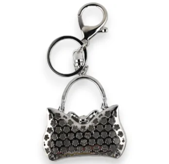 Silberner Schlüsselanhänger gestreifter schwarz-weißer Handtasche