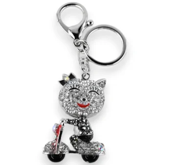 Silver small cat keychain on a scooter