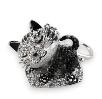 Silver Cat Keychain on its Cushion