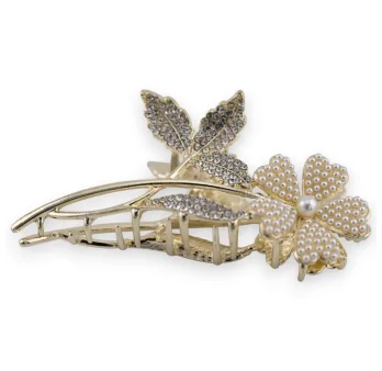 Goldene Haarspange mit Blume auf ihrem Perlen- und Strassstiel