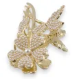 Golden hairclip with flower on its pearl stem