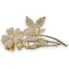 Golden hairclip with flower on its pearl stem