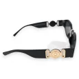 Black rectangular glasses with golden jewelry arms