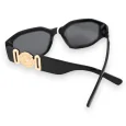 Black rectangular glasses with golden jewelry arms