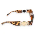 Gafas rectangulares de leopardo marrón con patillas anchas y joyas doradas