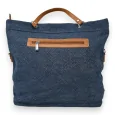 Handbag in raw blue jeans fabric with a strip of shiny stones