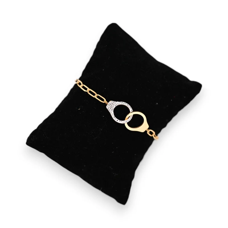 Pulsera de acero dorado con esposas lisas y strass