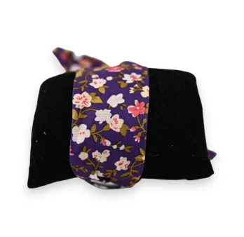 Watch with purple fabric strap and multicolored floral pattern