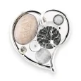 Silver heart-shaped magnetic brooch with decorative stones