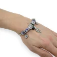 Silver and lilac rigid charm bracelet with treble clef