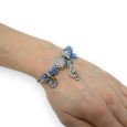 Blue and silver rigid charms bracelet with treble clef