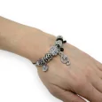 Silver and black rigid charm bracelet with a treble clef