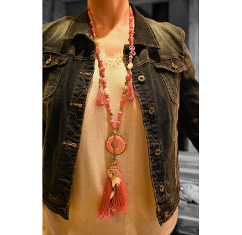 Fuchsia fancy pendant necklace with round medallion, tassel and charms