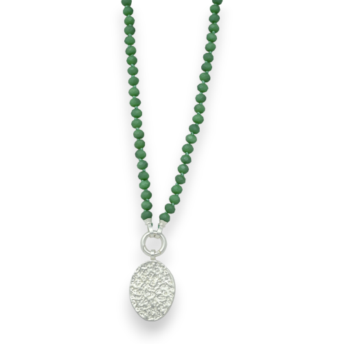 Fantasy necklace with green beads and a brushed silver medallion