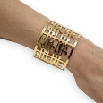 Gold cuff bracelet music notes