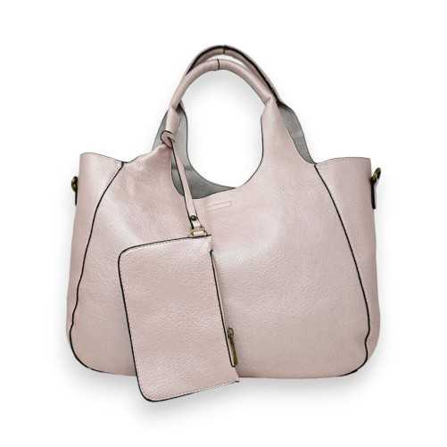 Große weiche Handtasche mit ihrem metallisch rosafarbenen Zubehör