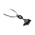 Black long necklace with resin medallion and assorted charms