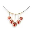 Gold necklace with red Ikita floral pendant