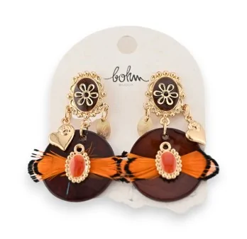 Golden earrings with orange feathers by BOHM