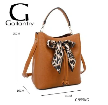 Elegant camel-colored rigid handbag with leopard print bow