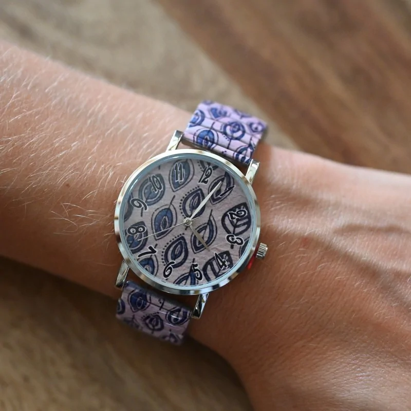 Ernest's watch printed blue sheets on a pink background
