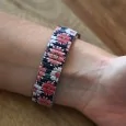 Ernest has a coral big daisy pattern watch