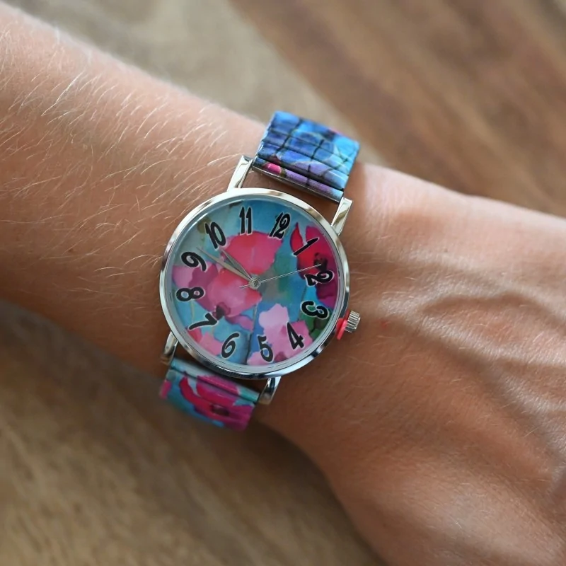 Ernest's watch with a fuchsia and turquoise floral pattern