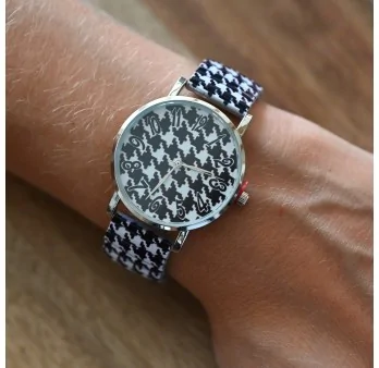 Ernest\'s watch has a black and white houndstooth pattern