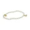 Thin elastic bracelet with white and gold beads