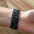 Ernest's black watch with multicolored stars