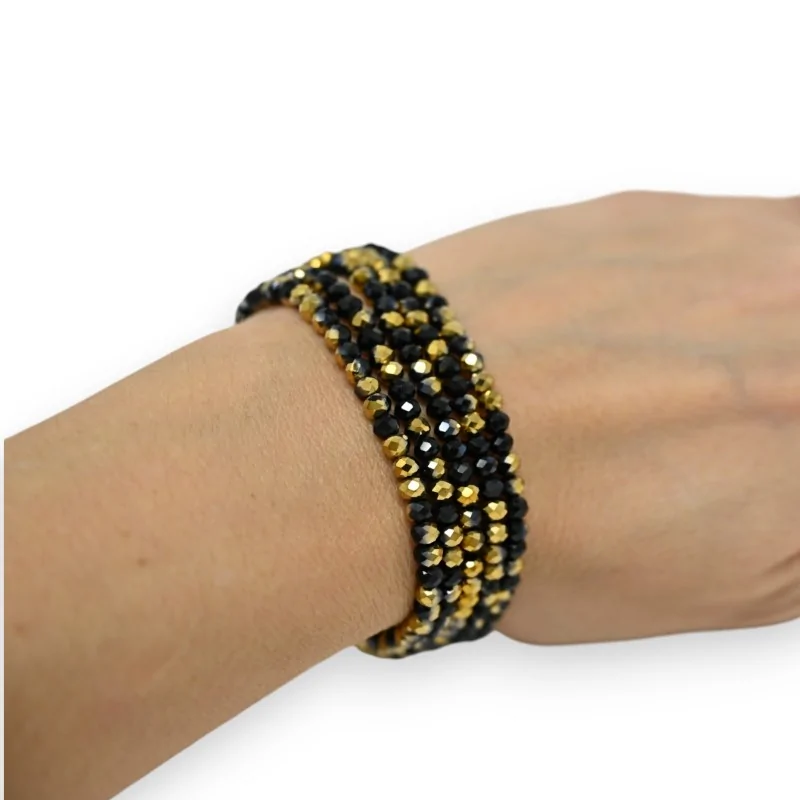 Multi-strand bracelet with golden and black beads