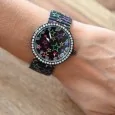 Ernest's black watch with multicolored stars