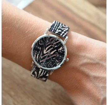 Ernest\'s watch is printed with black and beige animal pattern