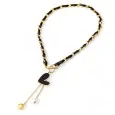 Gold-plated steel necklace with asymmetrical black heart