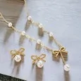 Gold-plated steel jewelry set: Necklace and Earrings with Knot and Pearls