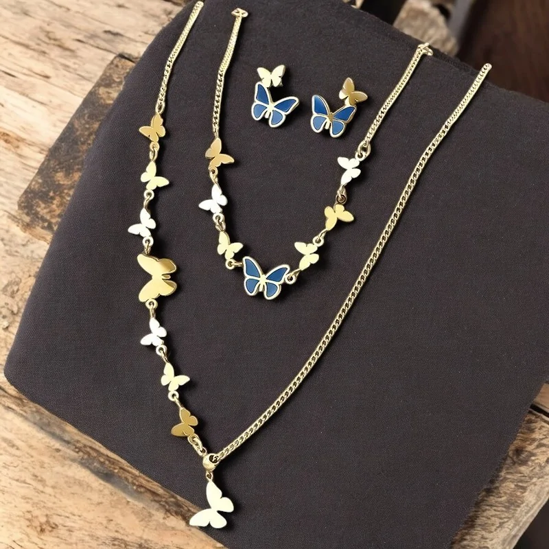 Schmuckset mit blauen und goldenen Schmetterlingen aus Stahl