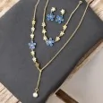 Golden steel jewelry set with blue flowers