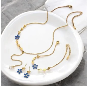 Golden steel jewelry set with blue flowers