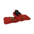 Red knitted mittens with golden knot