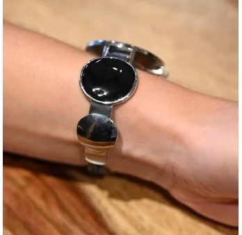 Ernest's black polka dot bracelet watch with a grey mirror dial
